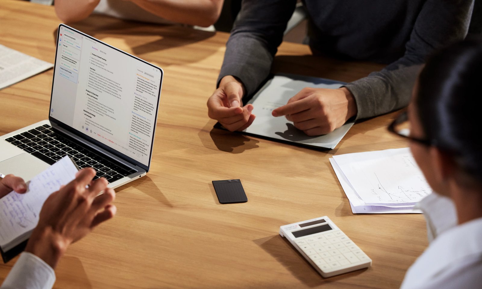 Professional reviewing presentation notes before a business meeting
