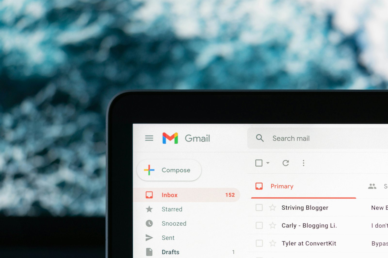 Professional managing email on a laptop