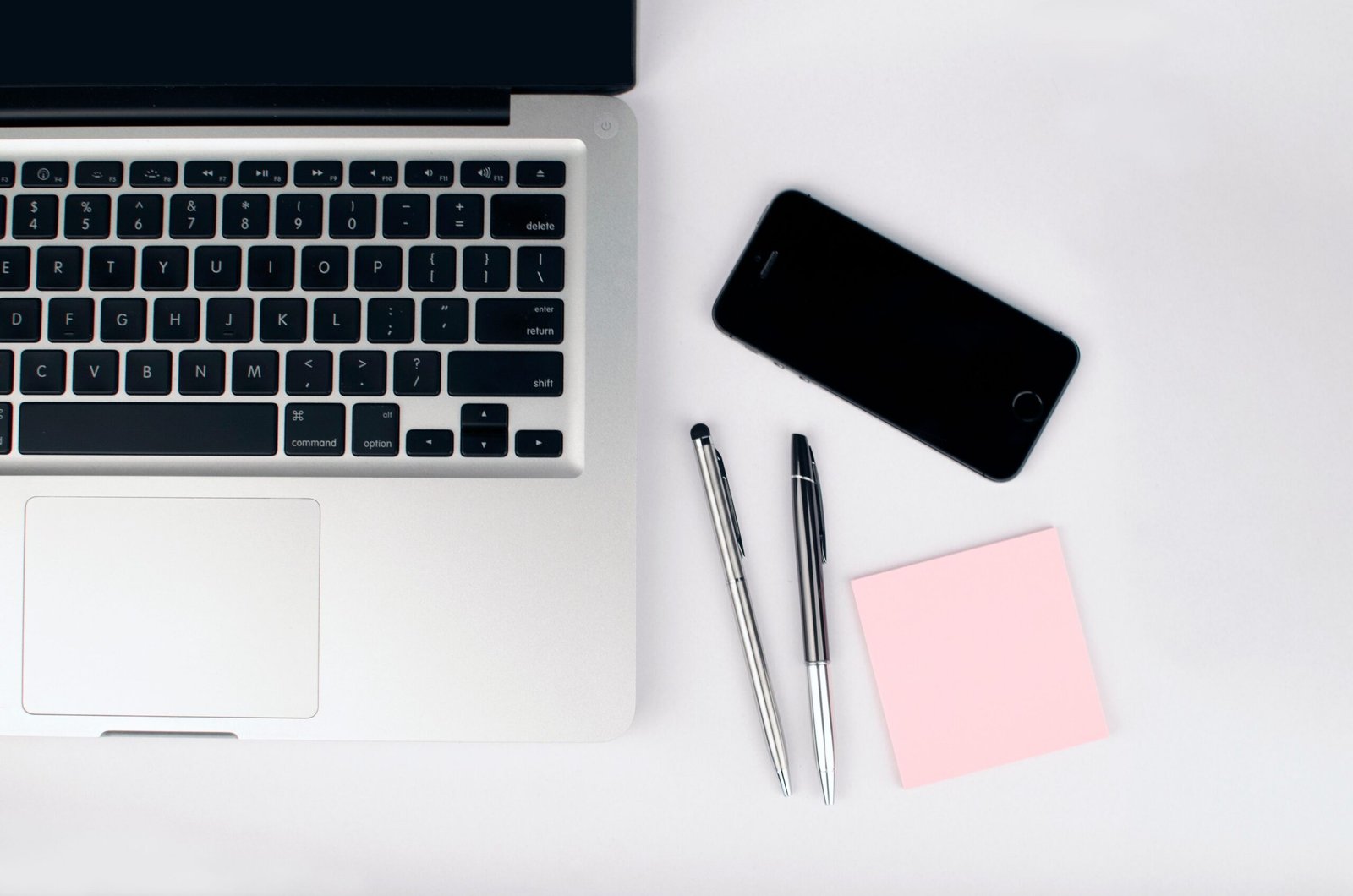Laptop workspace used to organize practical AI prompts for work