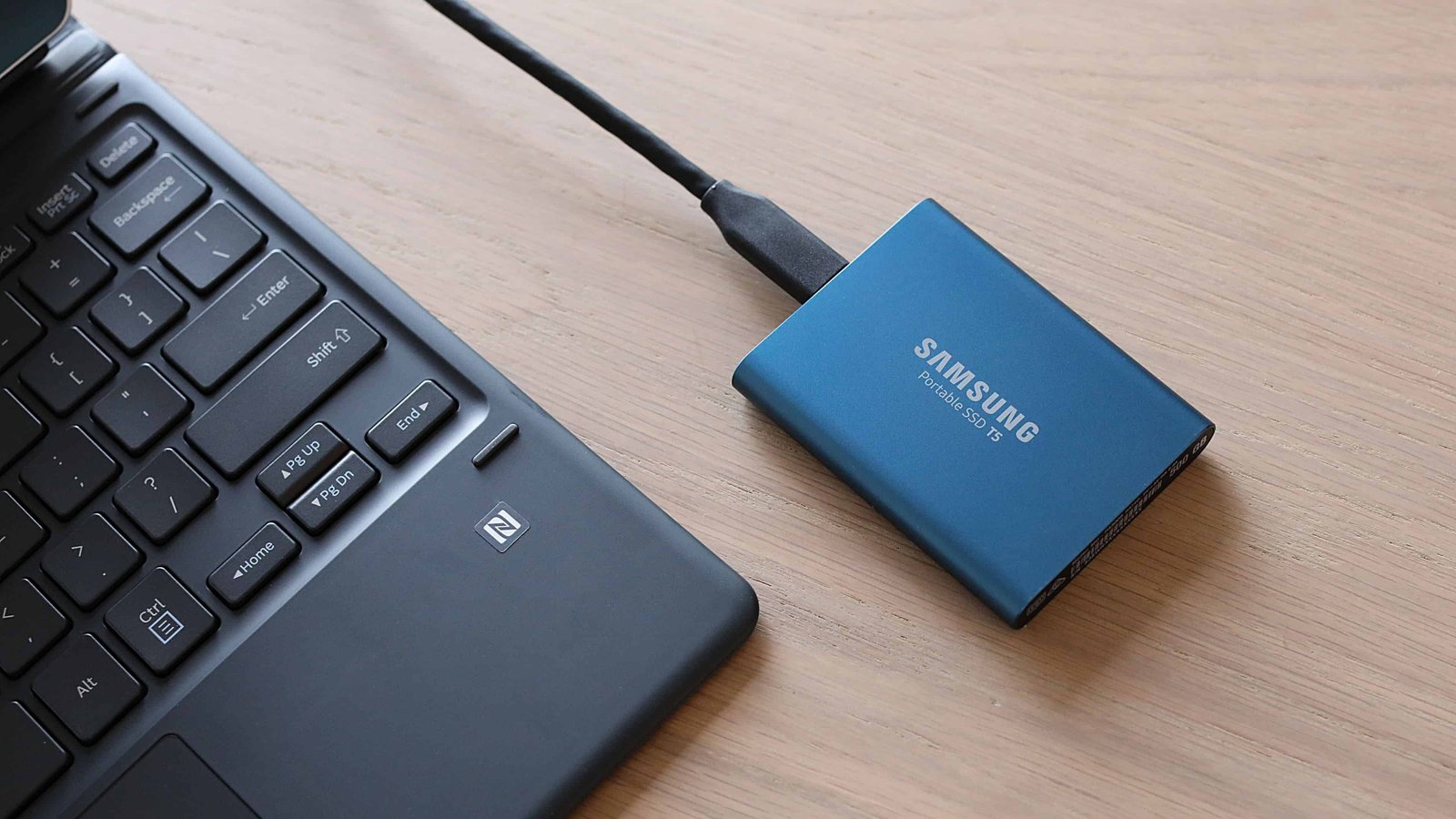 External drive and computer representing fast backup and portable storage