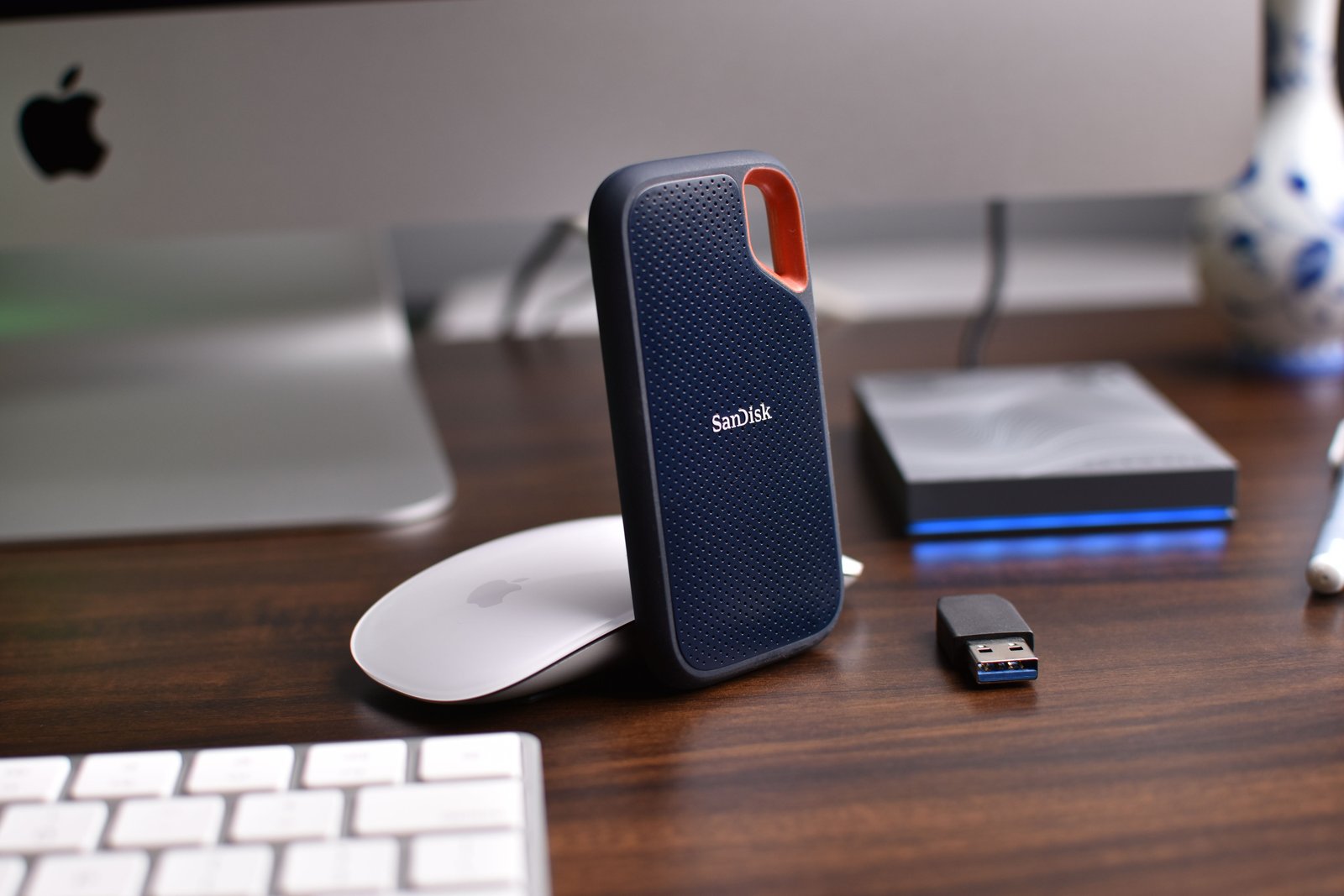 Portable external SSD beside a laptop for fast storage
