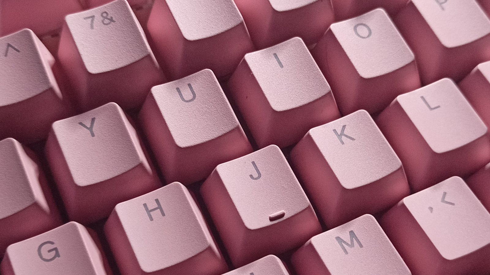 Mechanical keyboard on a modern computer desk