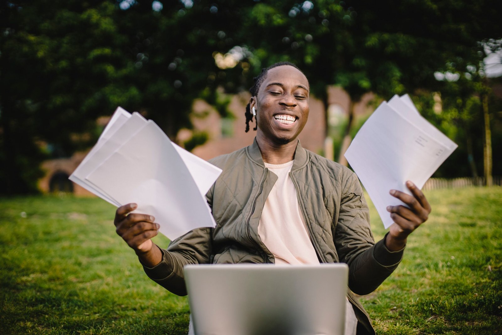 Laptop and documents representing AI document summarization of long reports