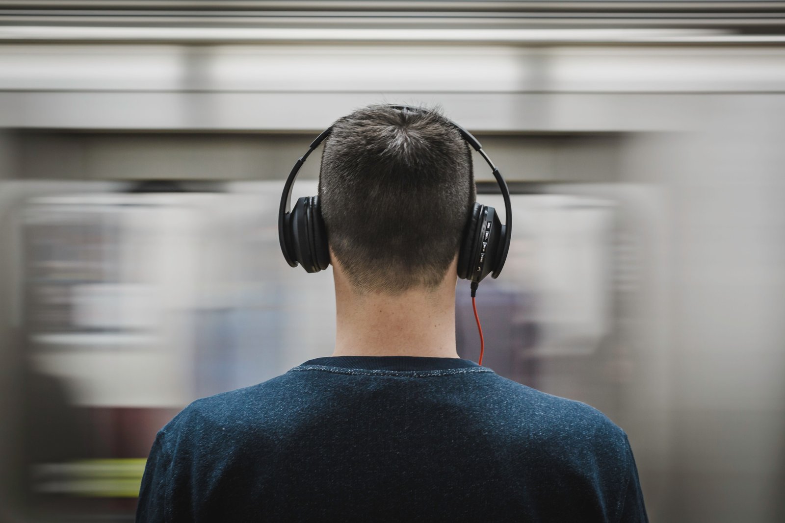 Remote professional positioned in front of a webcam and headset