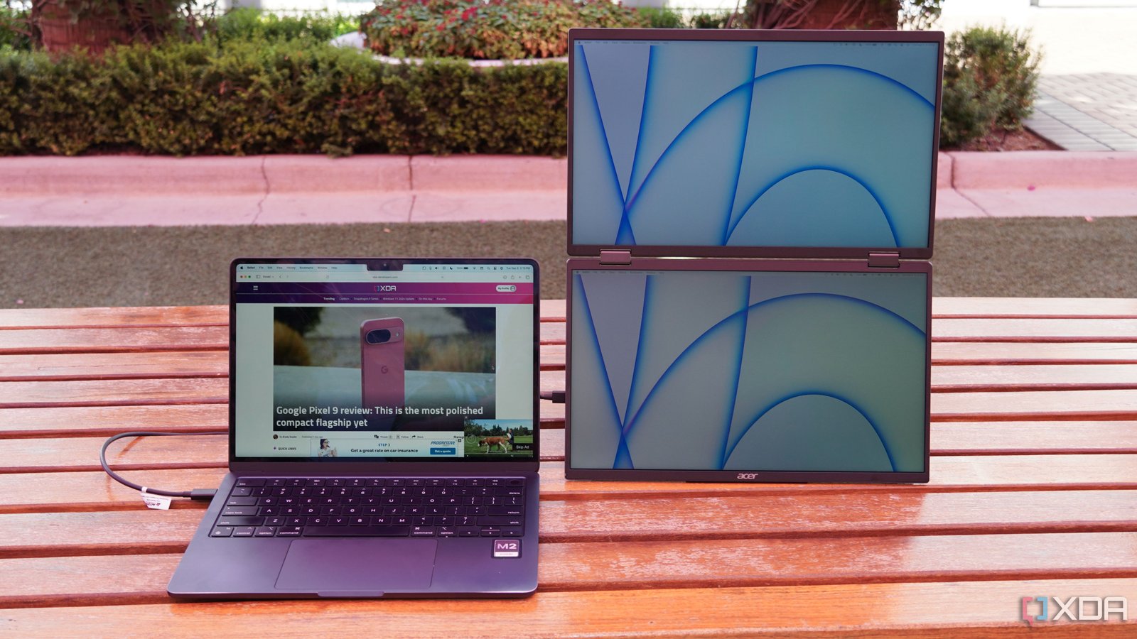Portable monitor beside a laptop for a dual-screen mobile workspace