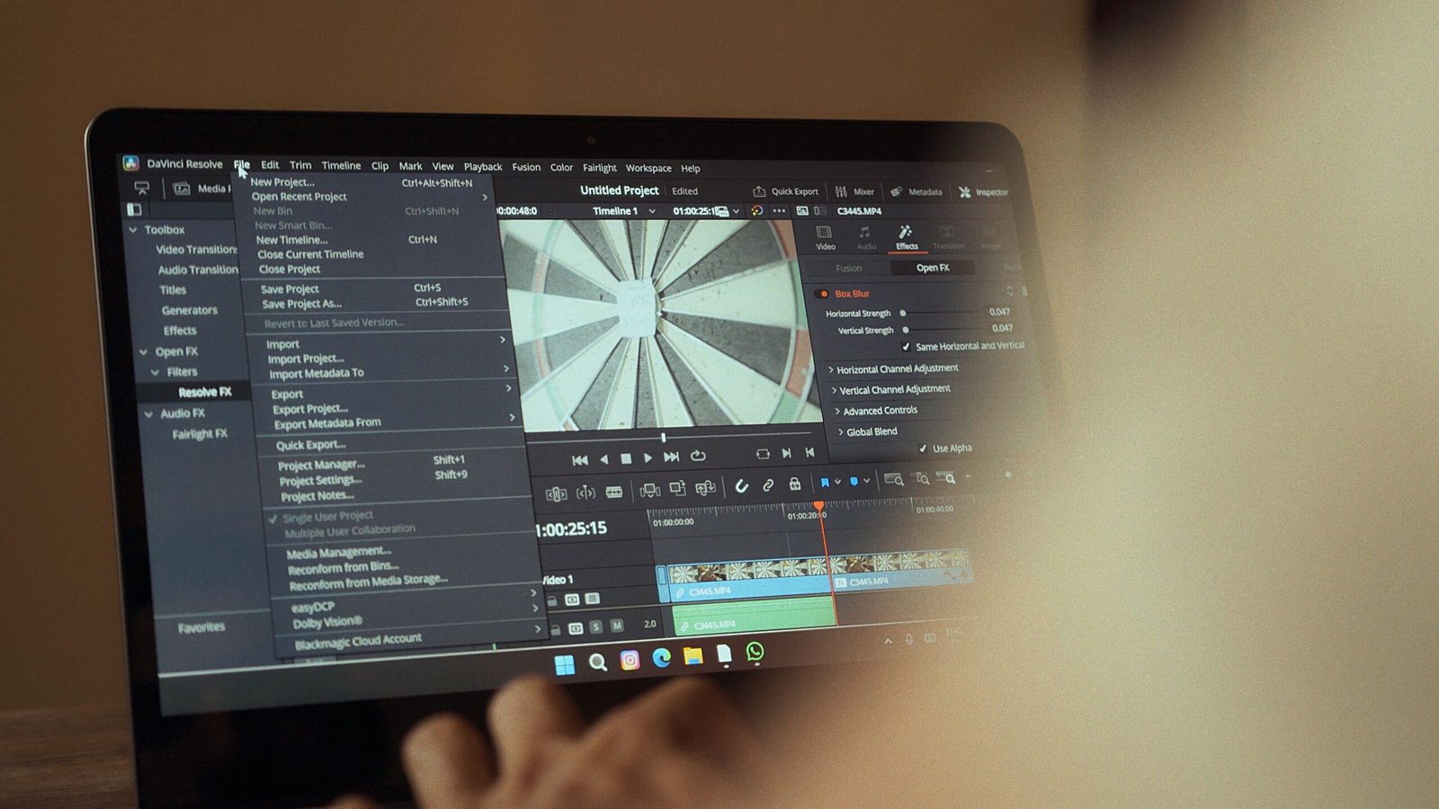 Creator editing video on a computer using AI-assisted video software